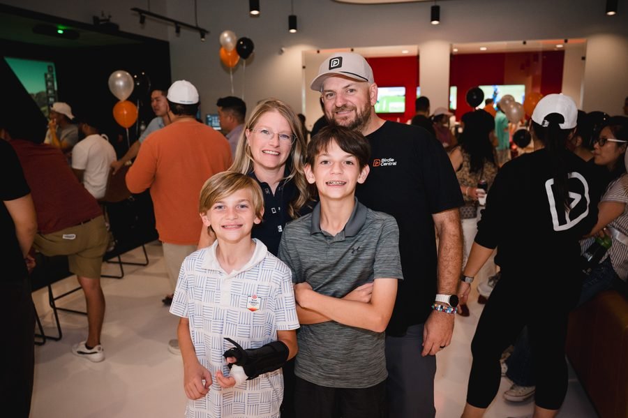 A family with two kids celebrating at Birdie Central